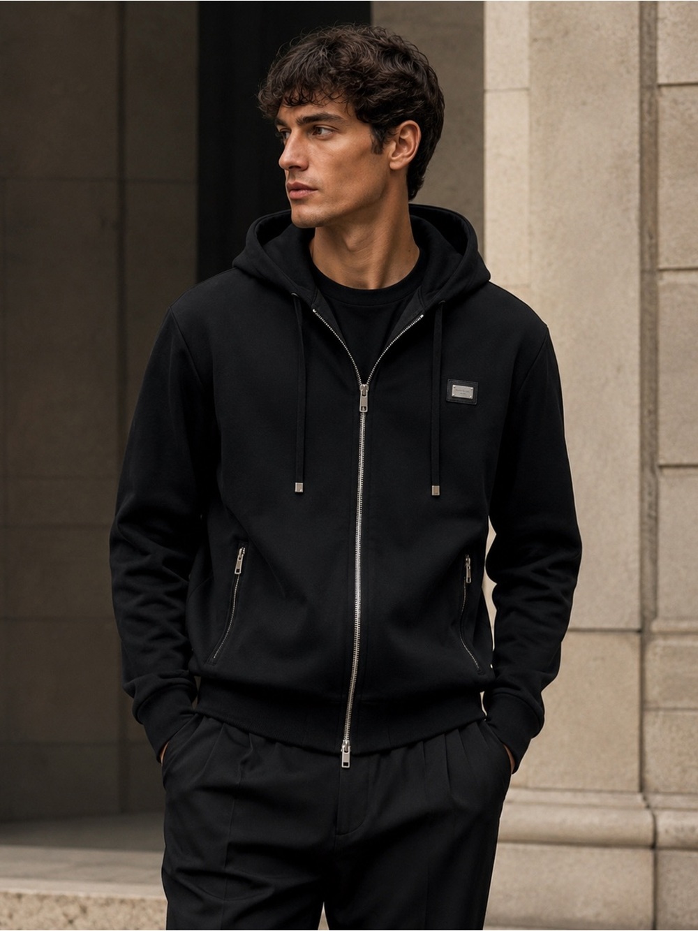 Dolce & Gabbana black zip-up hoodie with the metal logo plaque